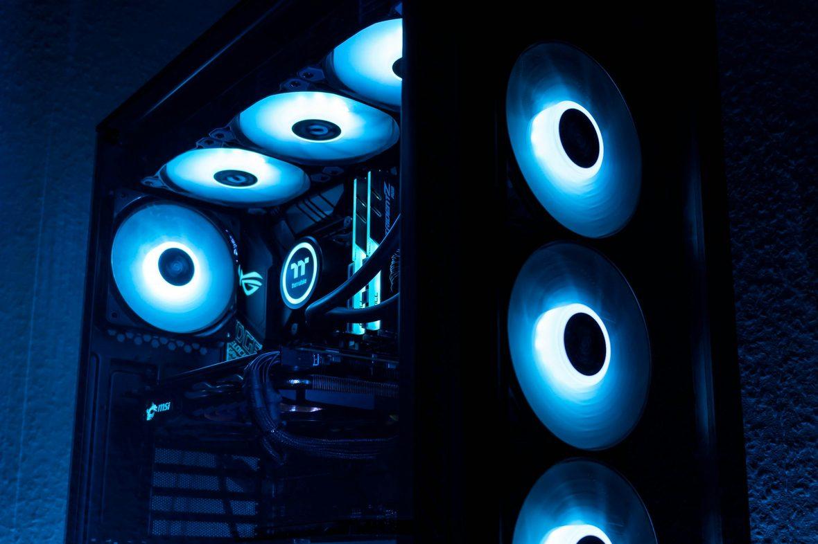 A high-performance compute machine with cooling fans lit