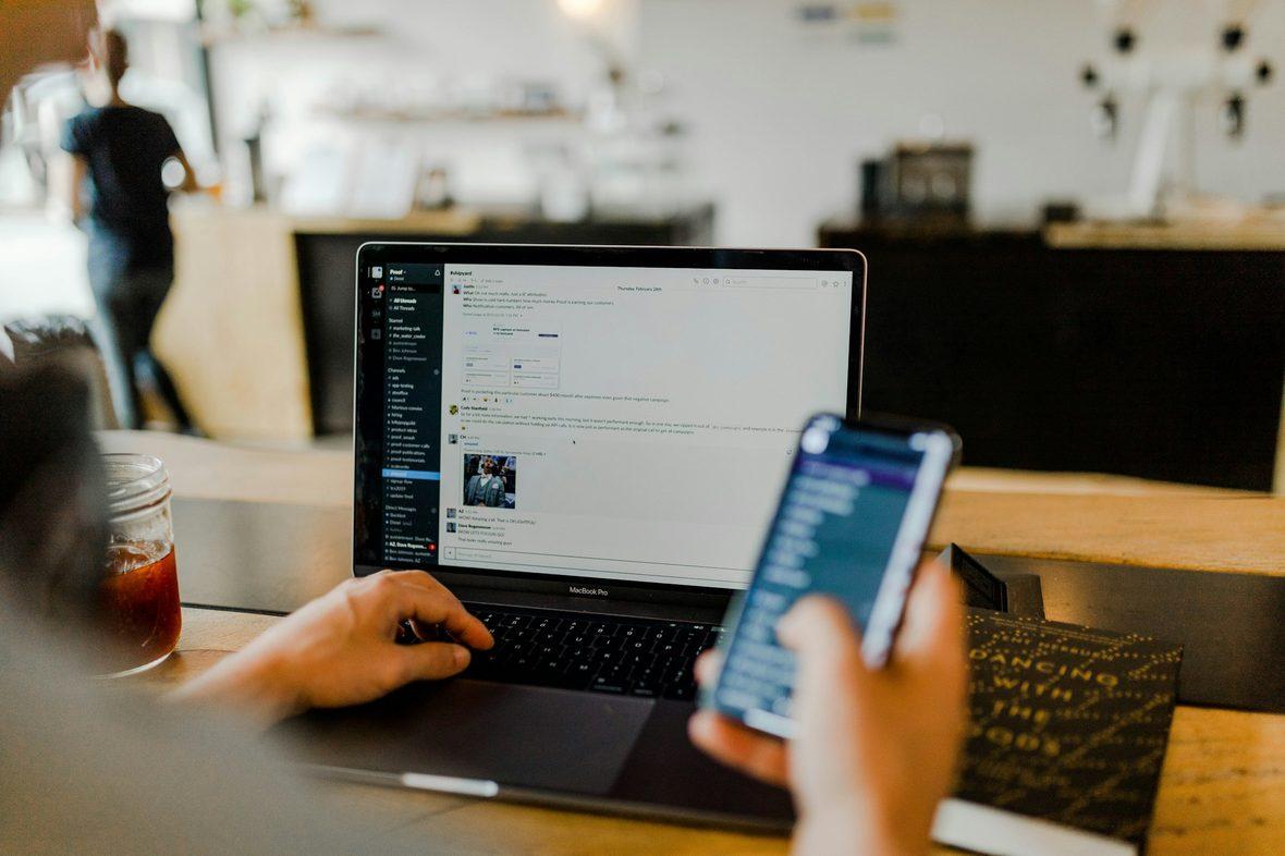 A phone and laptop used side by side on the same product