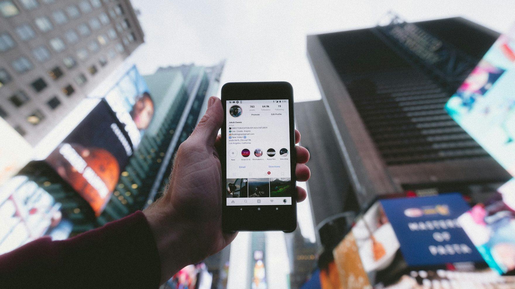 Someone using a mobile app on the street