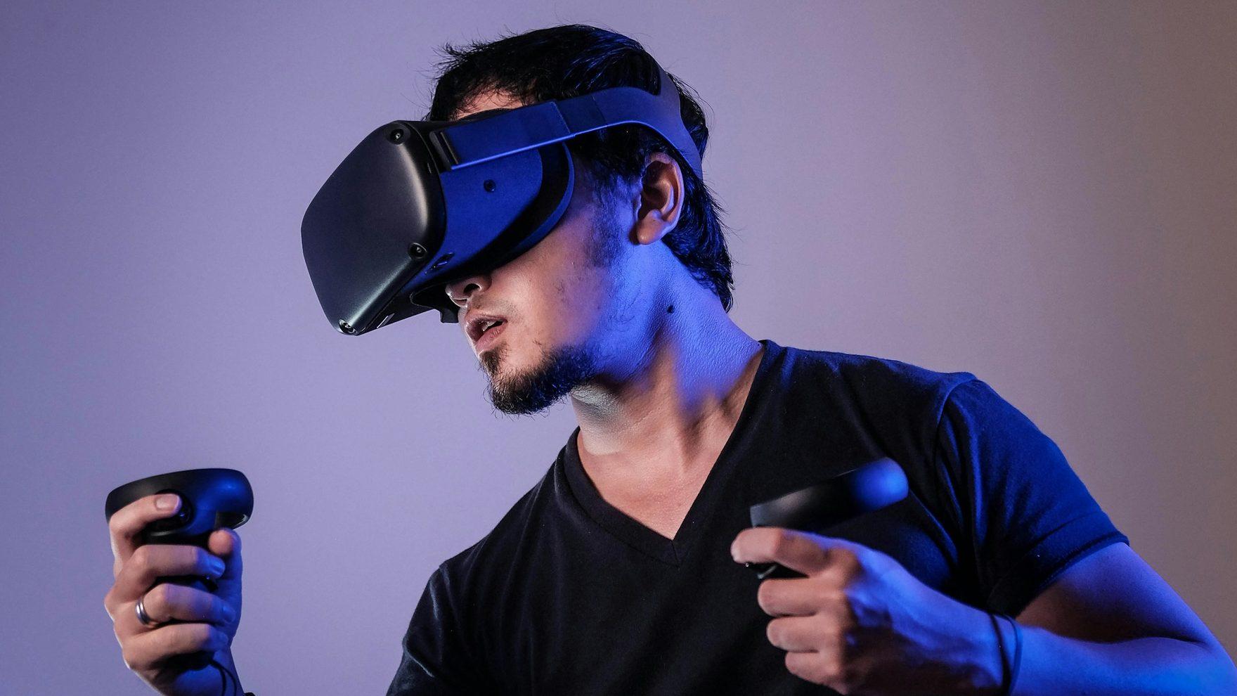 A person using a VR headset and hand controllers