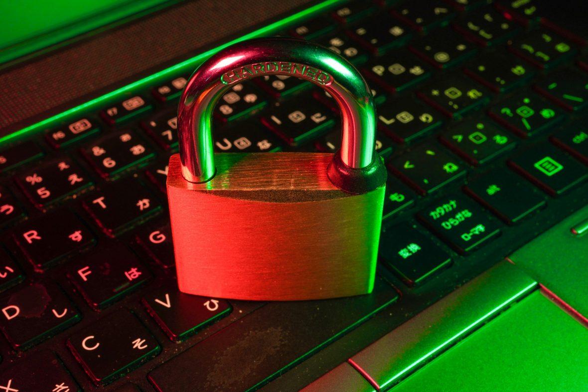 A padlock resting on a backlit keyboard