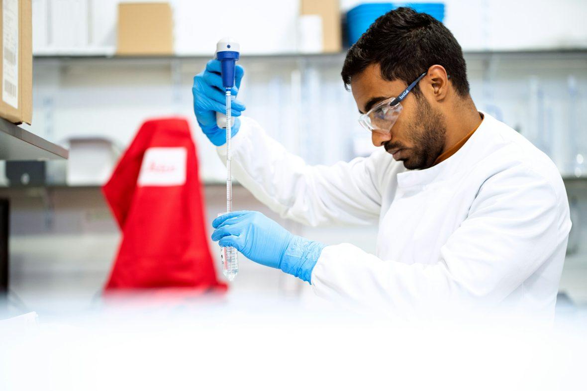 A researcher running samples in a laboratory